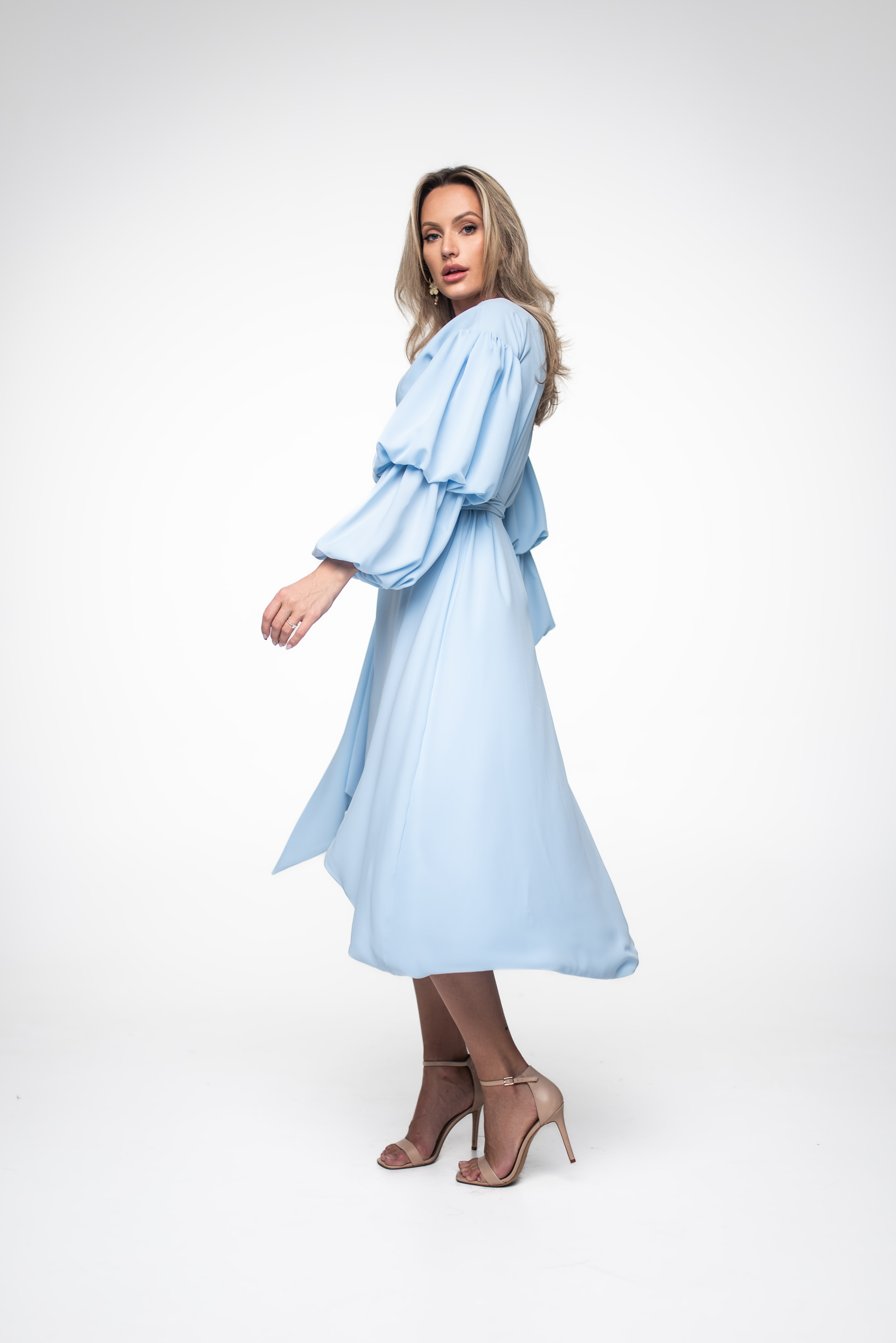 Woman with light blue midi dress